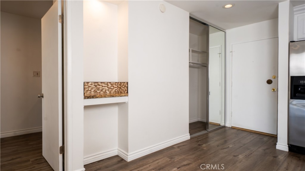 102 Scholz Plaza, Unit 37 Newport Beach, CA 92663 - Photo 6 of 12 a view of walk in closet with wooden floor