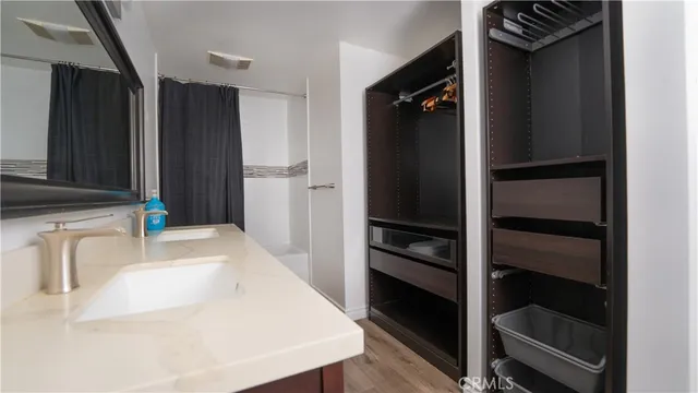 a kitchen with a refrigerator and a sink