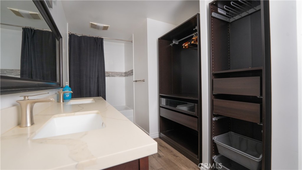 102 Scholz Plaza, Unit 37 Newport Beach, CA 92663 - Photo 7 of 12 a kitchen with a refrigerator and a sink