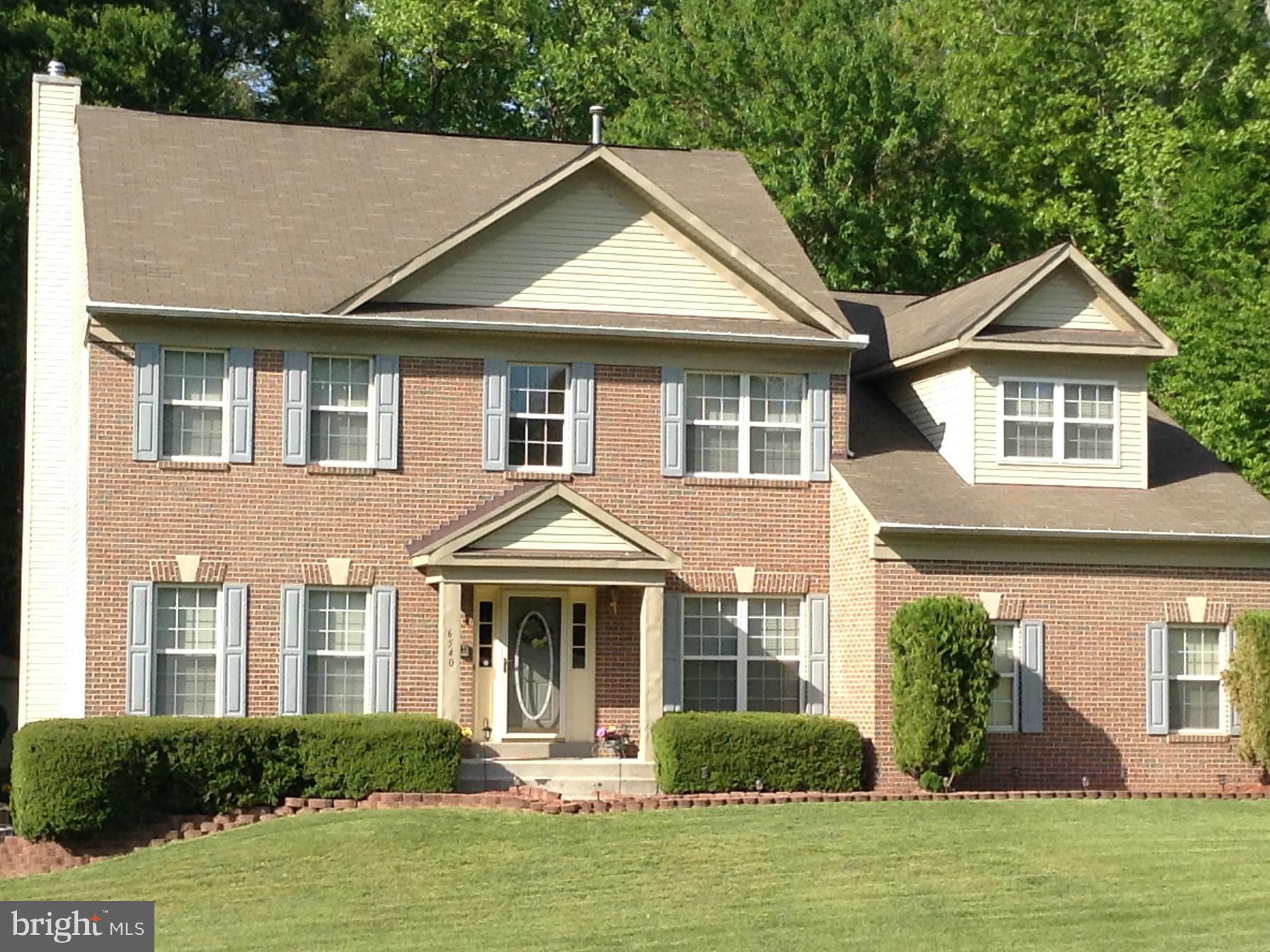 6540 Running Brook Road Manassas, VA 20112 - Photo 1 of 17 a front view of a house with a yard