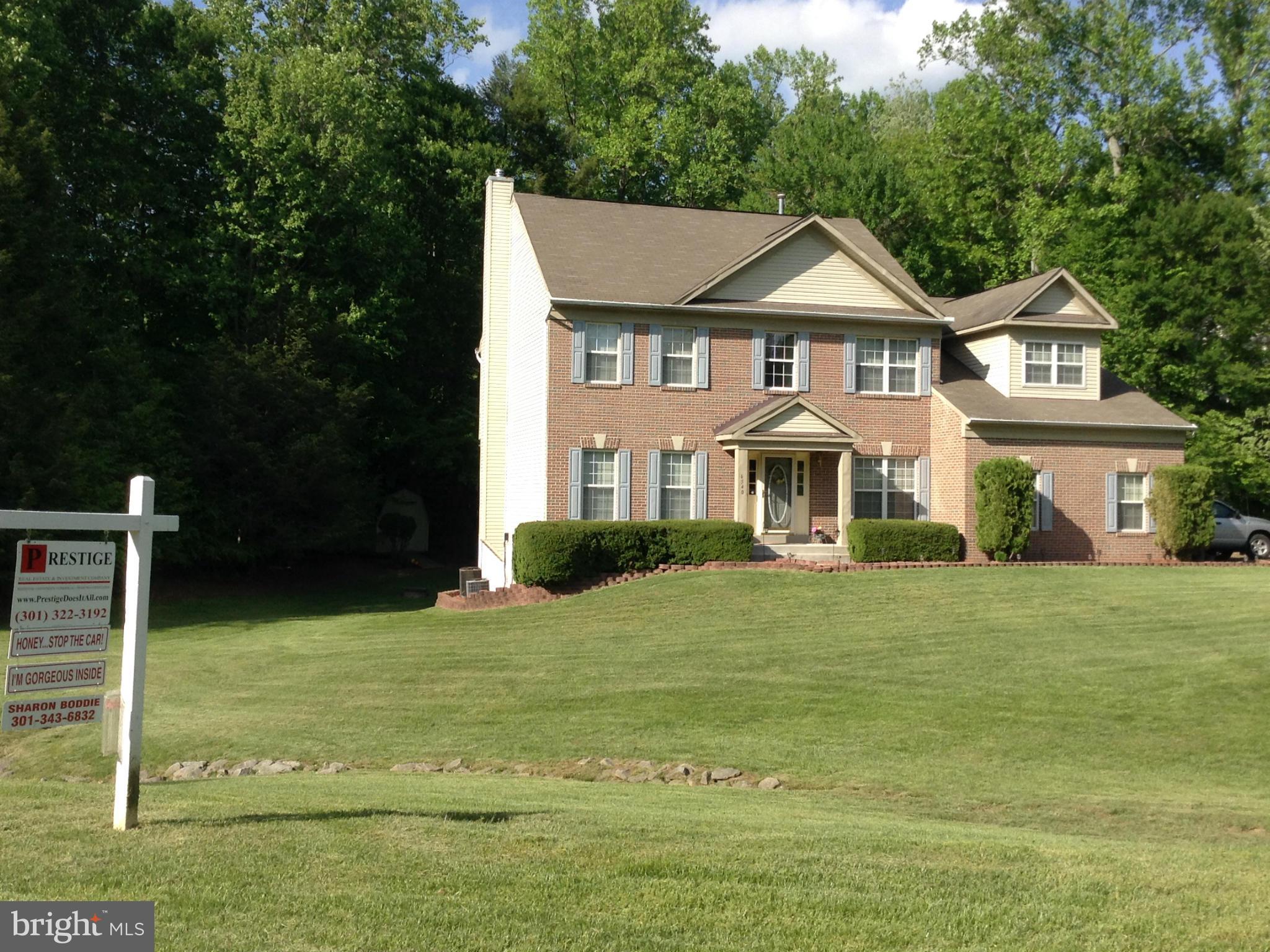 6540 Running Brook Road Manassas, VA 20112 - Photo 12 of 17 a front view of a house with a yard