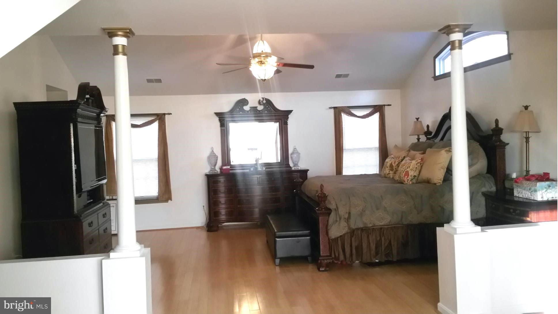 6540 Running Brook Road Manassas, VA 20112 - Photo 6 of 17 a living room with furniture and a flat screen tv