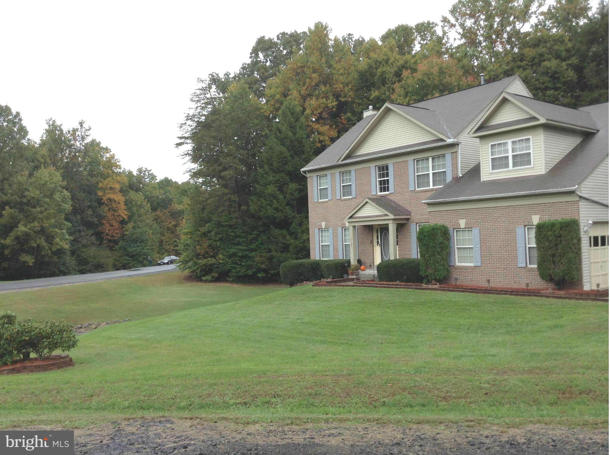 6540 Running Brook Road Manassas, VA 20112 - Photo 9 of 17 a view of a yard in front of a house