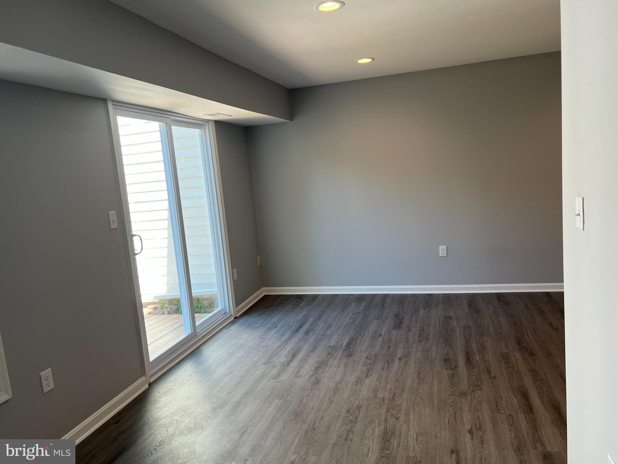 3807 Port Hope Point Triangle, VA 22172 - Photo 17 of 22 an empty room with wooden floor and windows