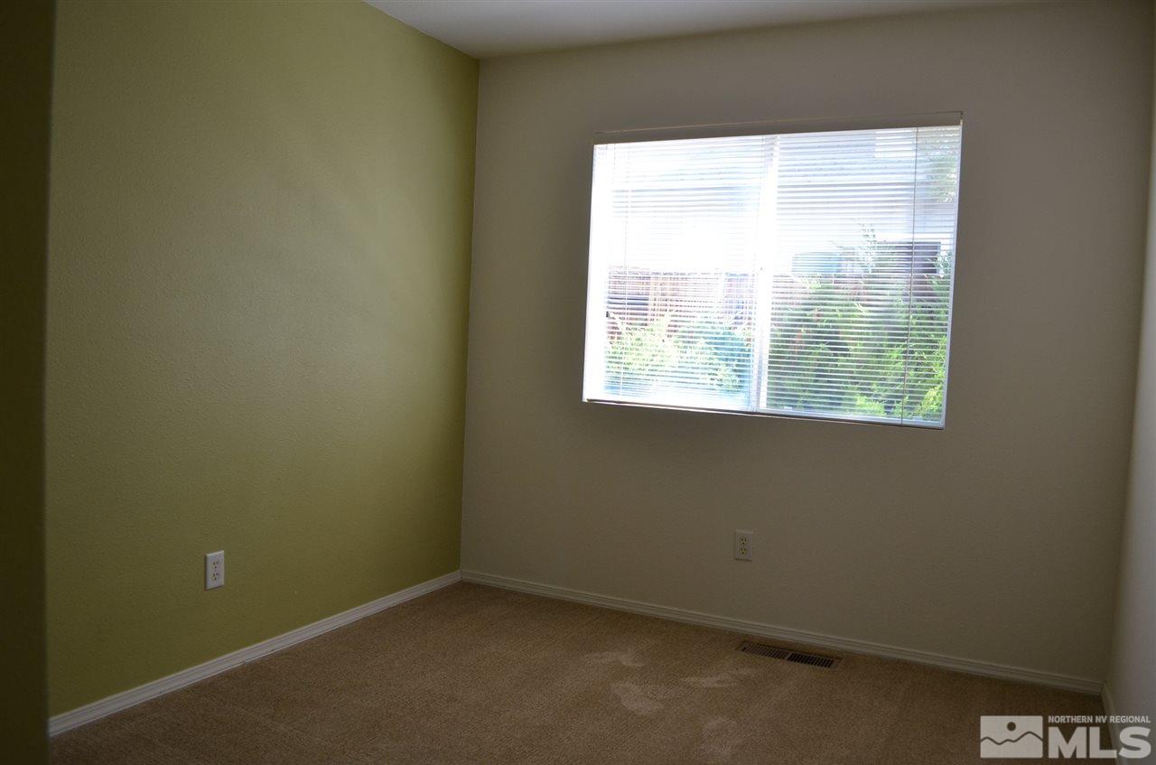 4668 Goodwin Road Sparks, NV 89436 - Photo 11 of 13 an empty room with a window