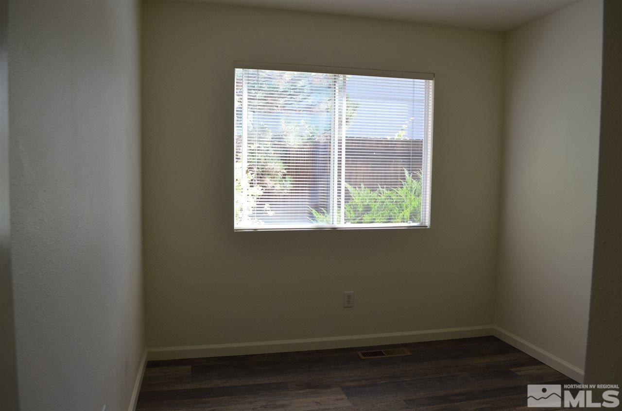 4668 Goodwin Road Sparks, NV 89436 - Photo 12 of 13 a view of a small space with wooden floor and a window