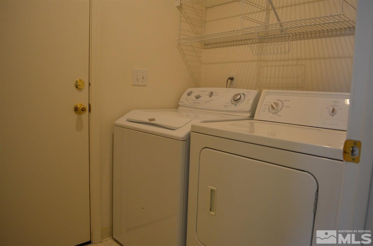 4668 Goodwin Road Sparks, NV 89436 - Photo 13 of 13 a utility room with dryer and washer