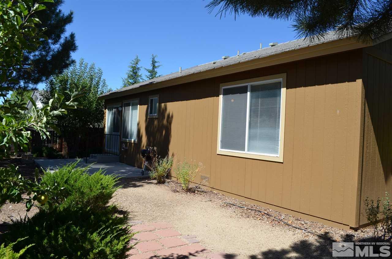 4668 Goodwin Road Sparks, NV 89436 - Photo 4 of 13 a front view of a house with a yard