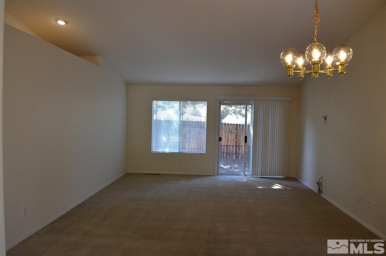 4668 Goodwin Road Sparks, NV 89436 - Photo 6 of 13 a view of an empty room with a window