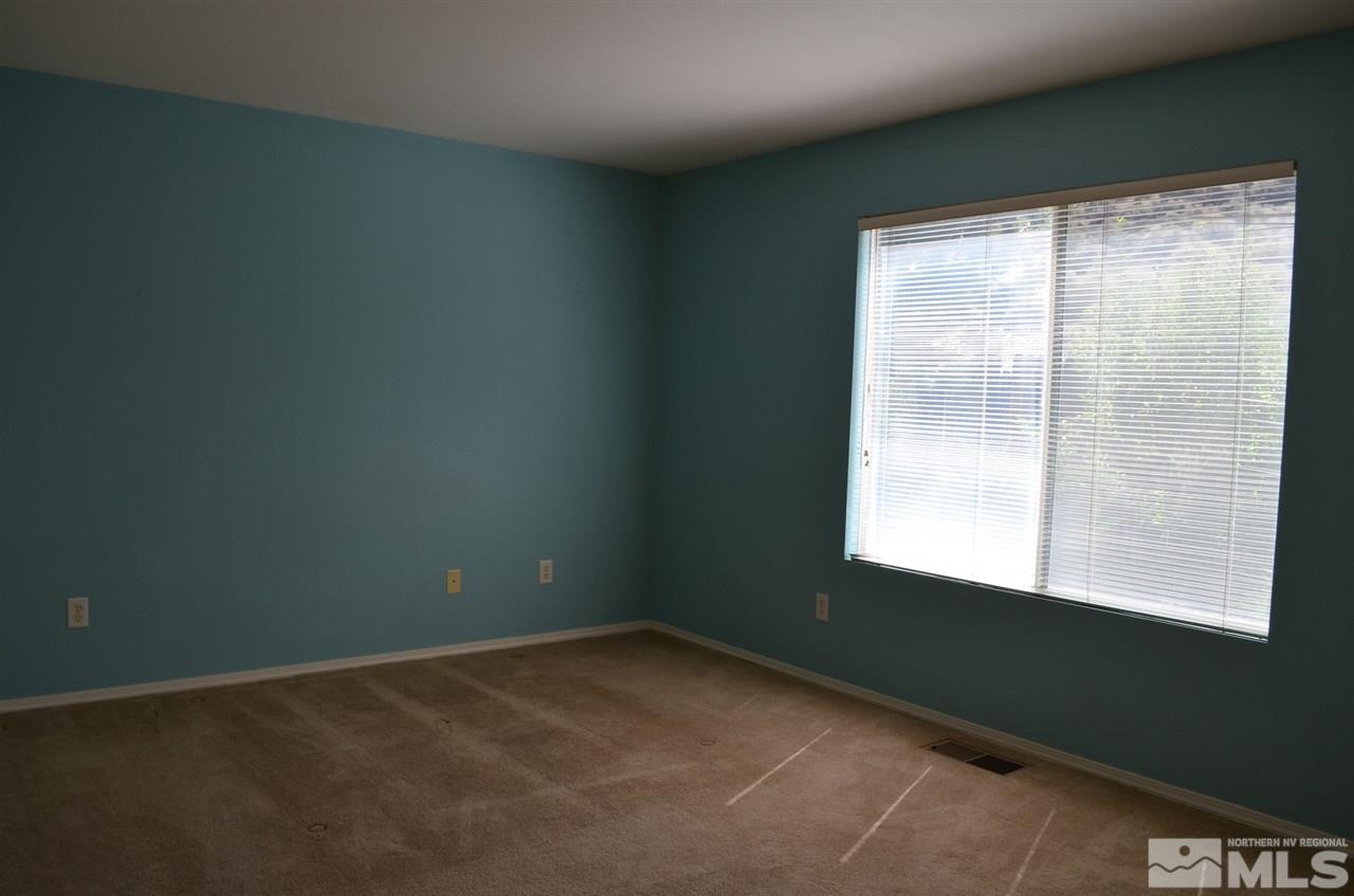 4668 Goodwin Road Sparks, NV 89436 - Photo 8 of 13 a view of an empty room with a window