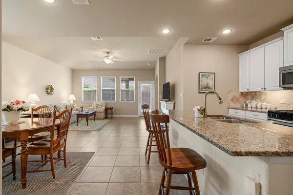 a view of a dining room kitchen and a sink
