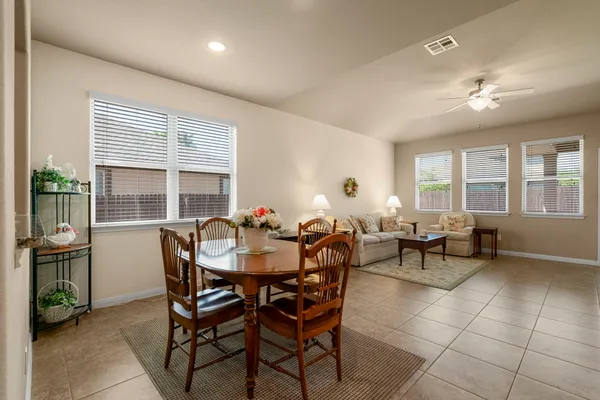 a dining room with furniture and window