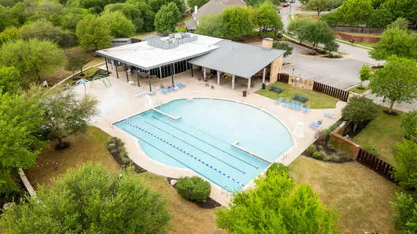 a view of a swimming pool with a patio