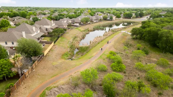 a view of a lake with trees by side of it