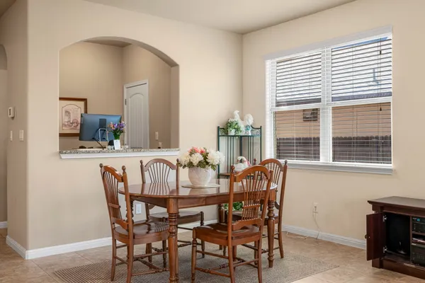 a view of a dining room with furniture and window