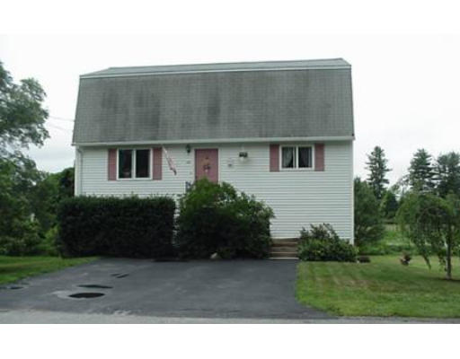 48 Fowler Road Lowell, MA 01854 - Photo 1 of 11 a front view of a house with a yard