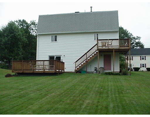 48 Fowler Road Lowell, MA 01854 - Photo 11 of 11 a view of a house with a yard and deck