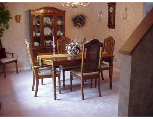 48 Fowler Road Lowell, MA 01854 - Photo 2 of 11 a view of a dining room with furniture and wooden floor