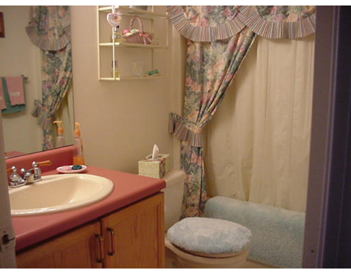 48 Fowler Road Lowell, MA 01854 - Photo 6 of 11 a bathroom with a sink toilet and a mirror