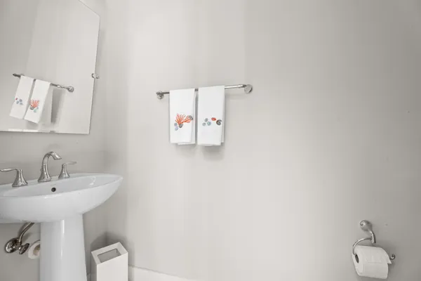 a bathroom with a sink and mirror