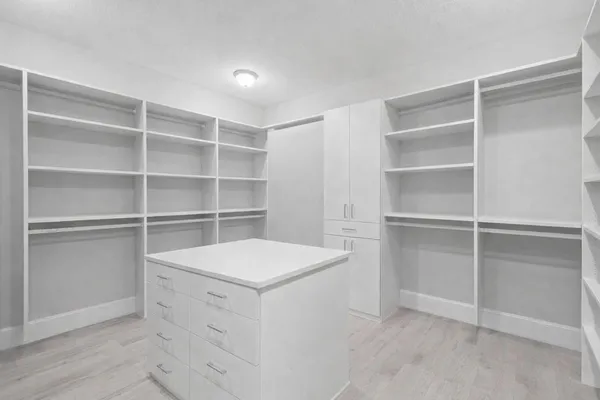 a view of an empty walk in closet