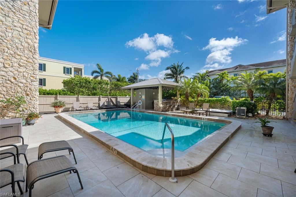333 4th Avenue South, Unit 202 Naples, FL 34102 - Photo 16 of 16 a view of a patio with swimming pool
