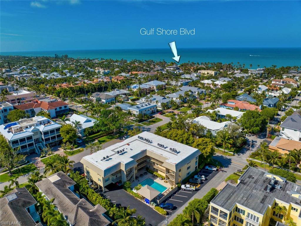 333 4th Avenue South, Unit 202 Naples, FL 34102 - Photo 4 of 16 an aerial view of a building with outdoor space