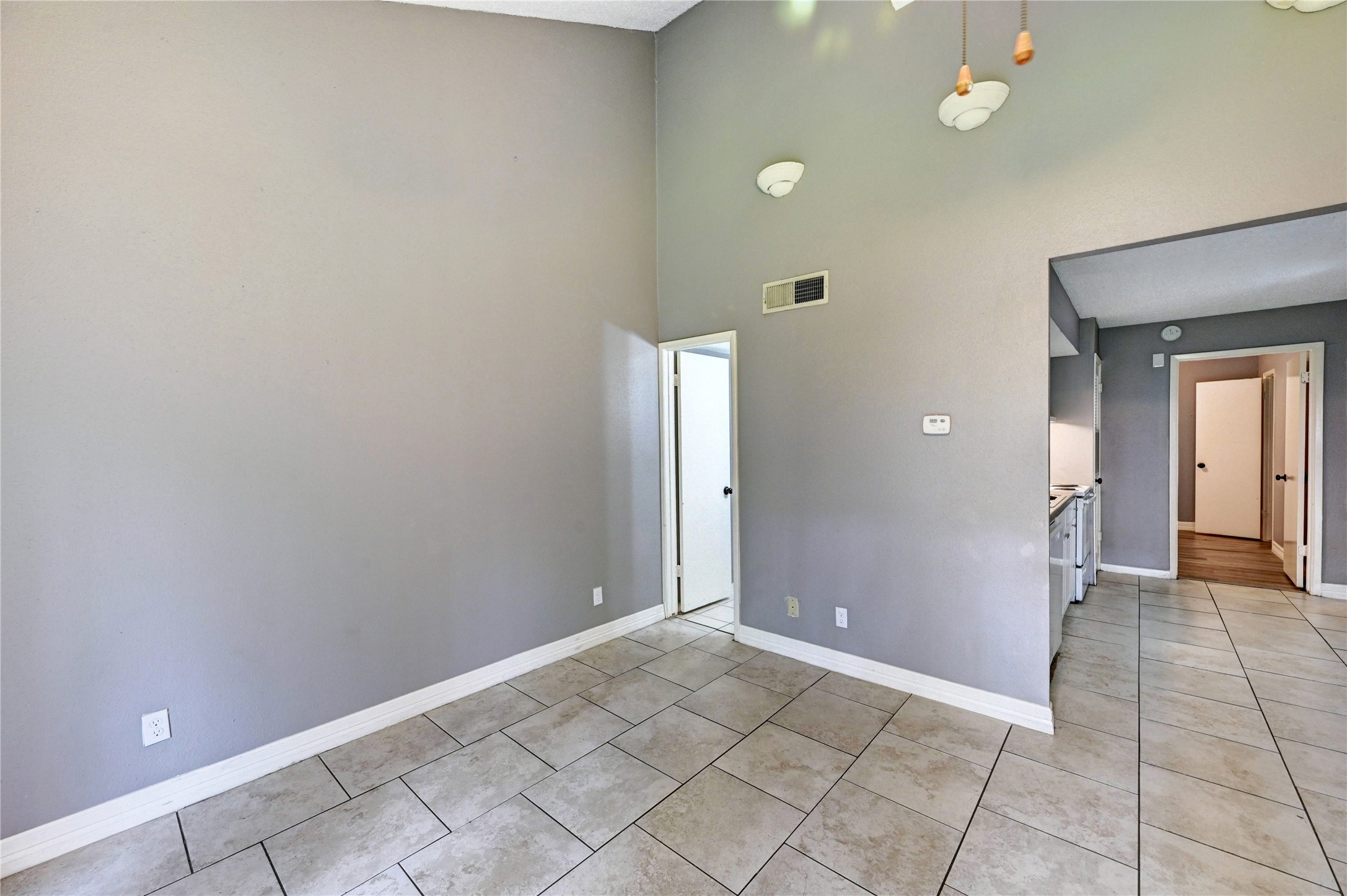 12900 Walden Road, Unit 6 Montgomery, TX 77356 - Photo 21 of 39 Lots of light and brightness in the living/dining room area.