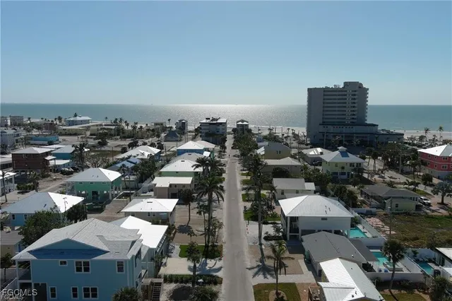 a roof deck with table and chairs potted plants