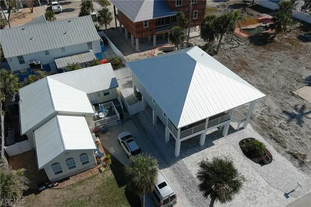 an aerial view of residential houses with outdoor space