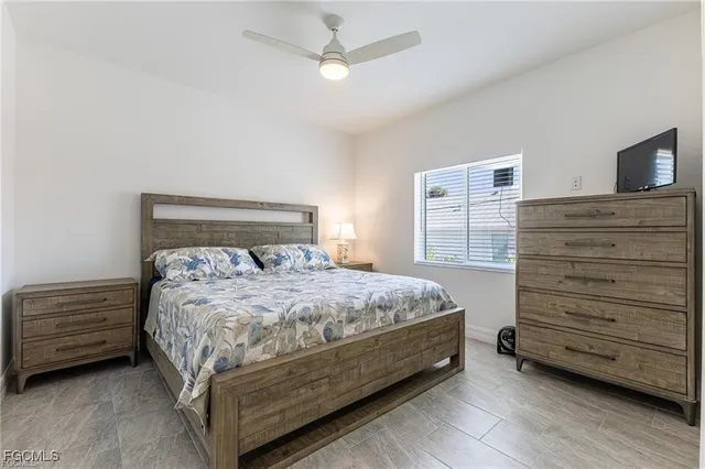 a bedroom with a bed and a dresser