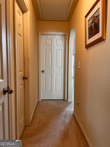 a view of a hallway with closet area