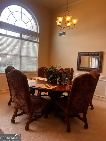 a view of a livingroom with furniture and a window
