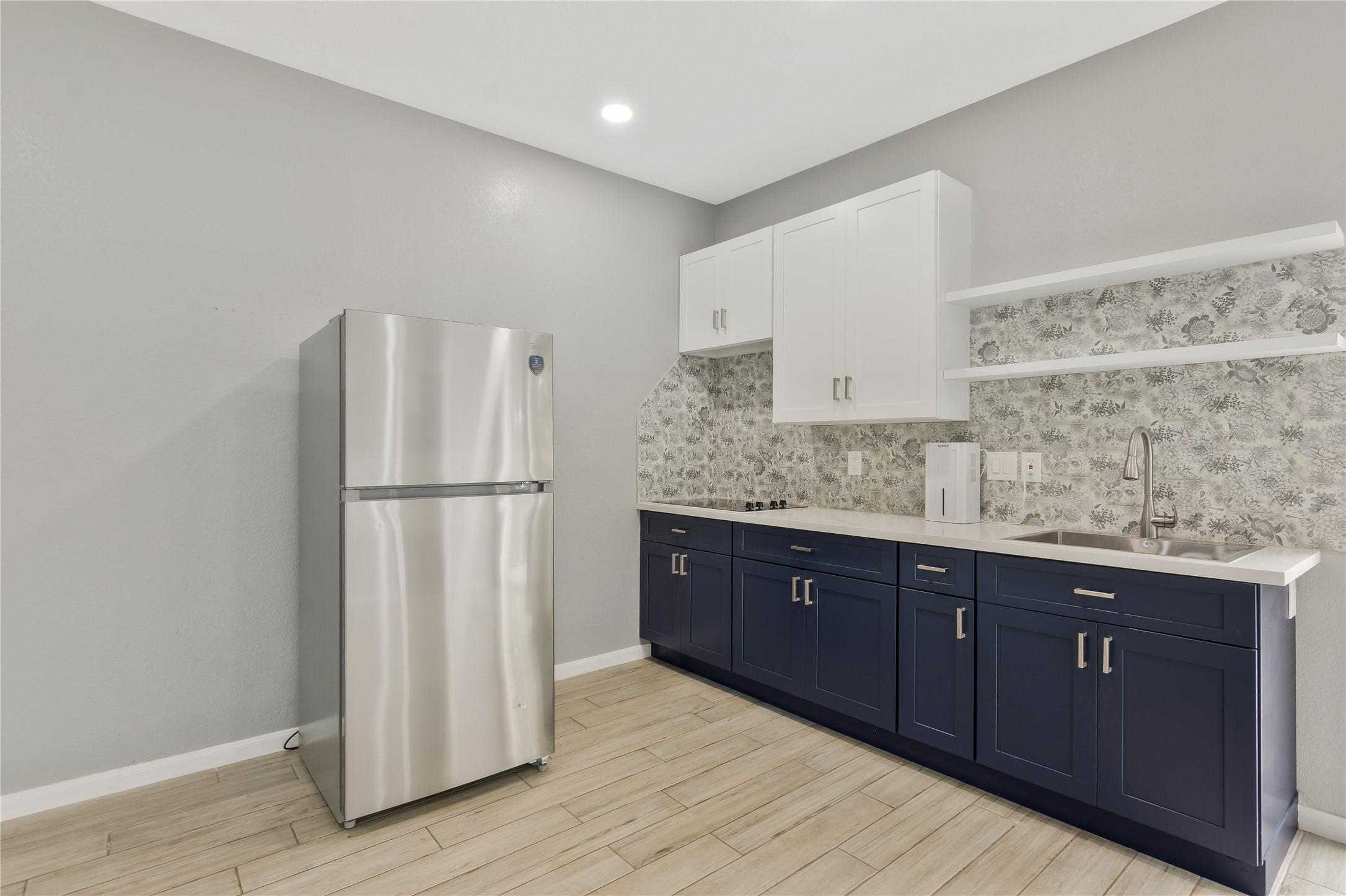 13914 Skinner Road Cypress, TX 77429 - Photo 40 of 50 Casita: Private kitchenette with full size refrigerator, cabinet storage, counter space, and tile flooring.
