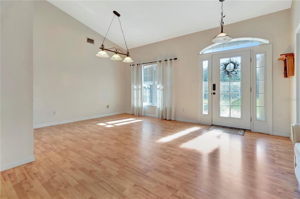 18611 Clark Road Altoona, FL 32702 - Photo 16 of 48 a view of an empty room with window and wooden floor