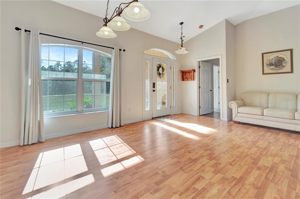 18611 Clark Road Altoona, FL 32702 - Photo 18 of 48 a view of empty room with wooden floor and fan