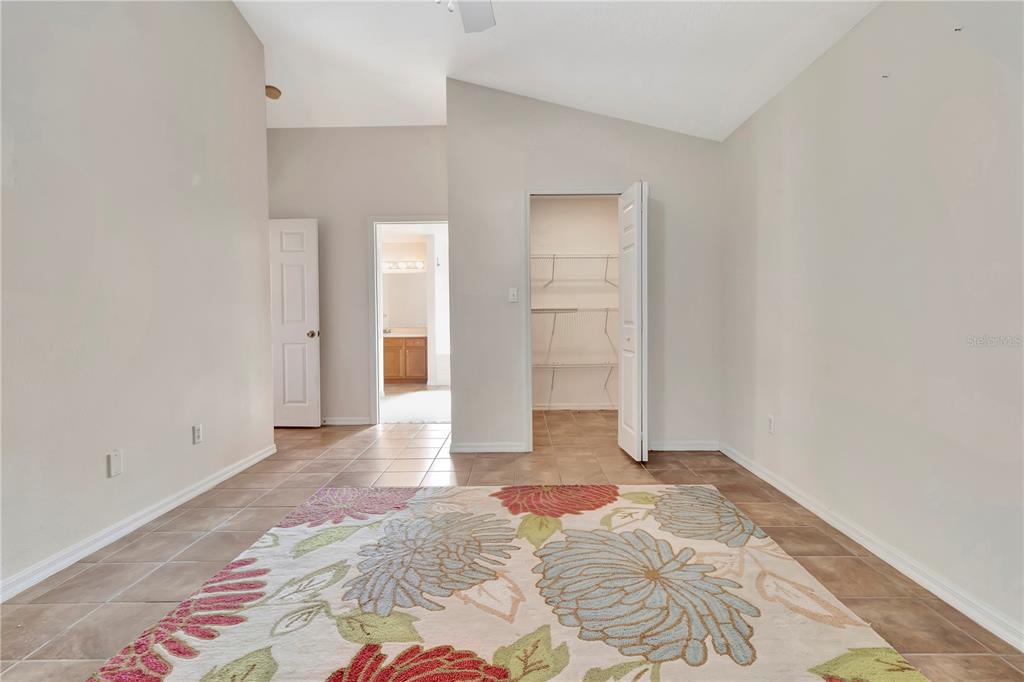 18611 Clark Road Altoona, FL 32702 - Photo 27 of 48 a view of a bedroom with wooden floor and closet