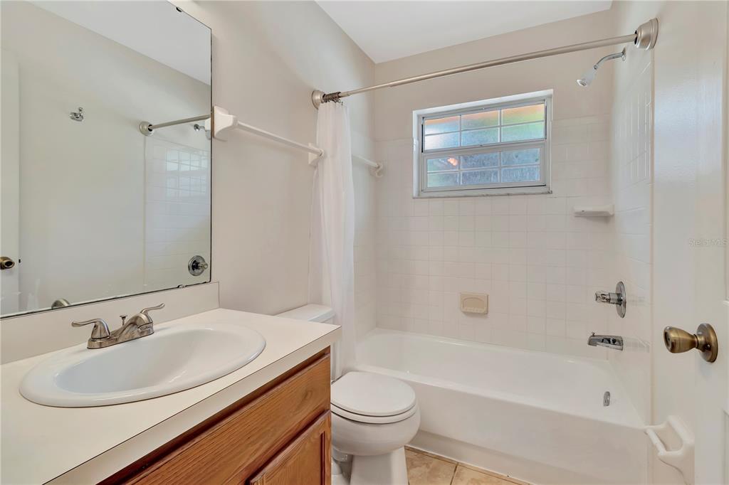 18611 Clark Road Altoona, FL 32702 - Photo 34 of 48 a bathroom with a sink toilet and shower