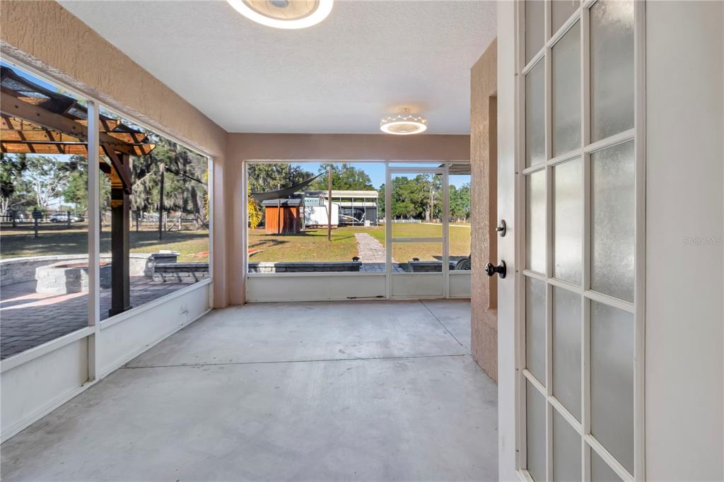 18611 Clark Road Altoona, FL 32702 - Photo 38 of 48 a view of a big room with windows and furniture