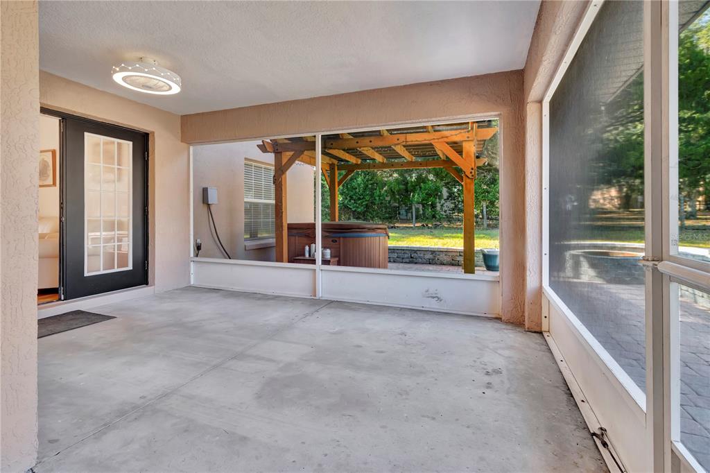 18611 Clark Road Altoona, FL 32702 - Photo 41 of 48 a view of an empty room with a fireplace and a large window