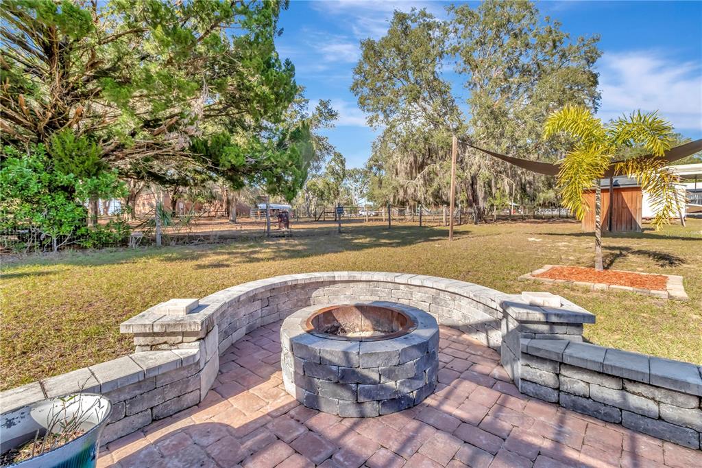 18611 Clark Road Altoona, FL 32702 - Photo 43 of 48 a view of a swimming pool with a patio and a yard