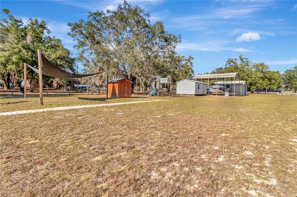 18611 Clark Road Altoona, FL 32702 - Photo 45 of 48 a view of a house with a yard and large trees