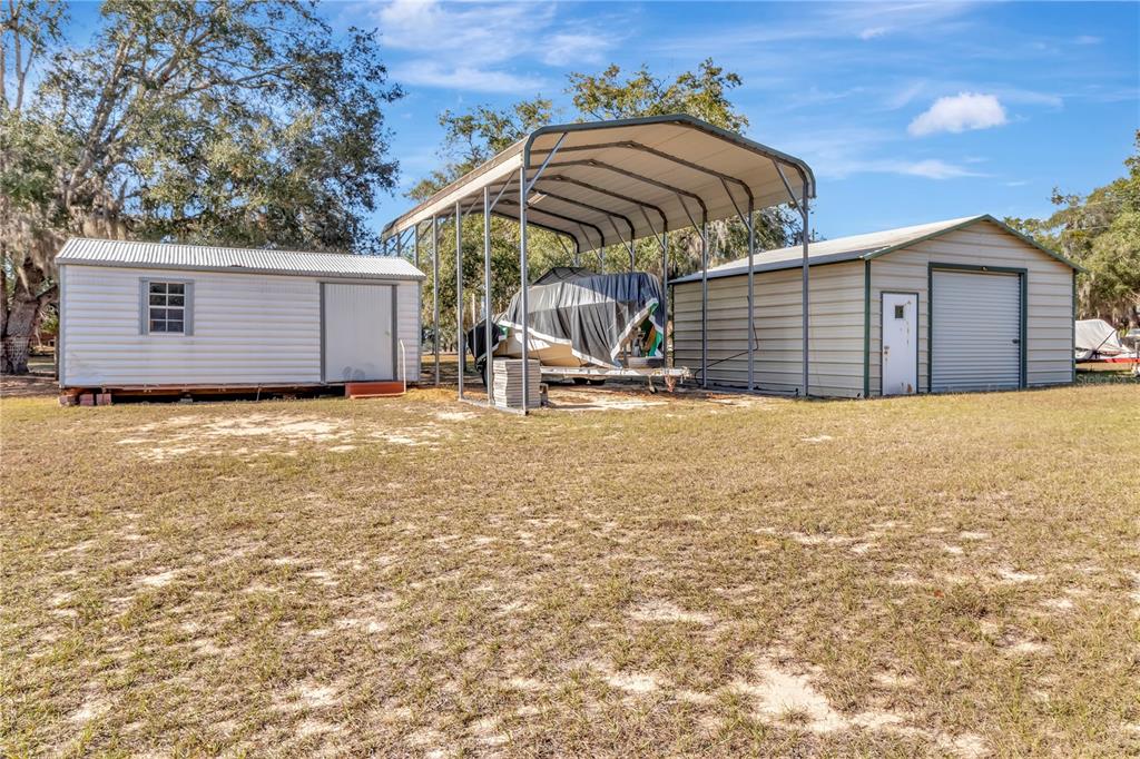 18611 Clark Road Altoona, FL 32702 - Photo 47 of 48 a view of a house with a yard and garage