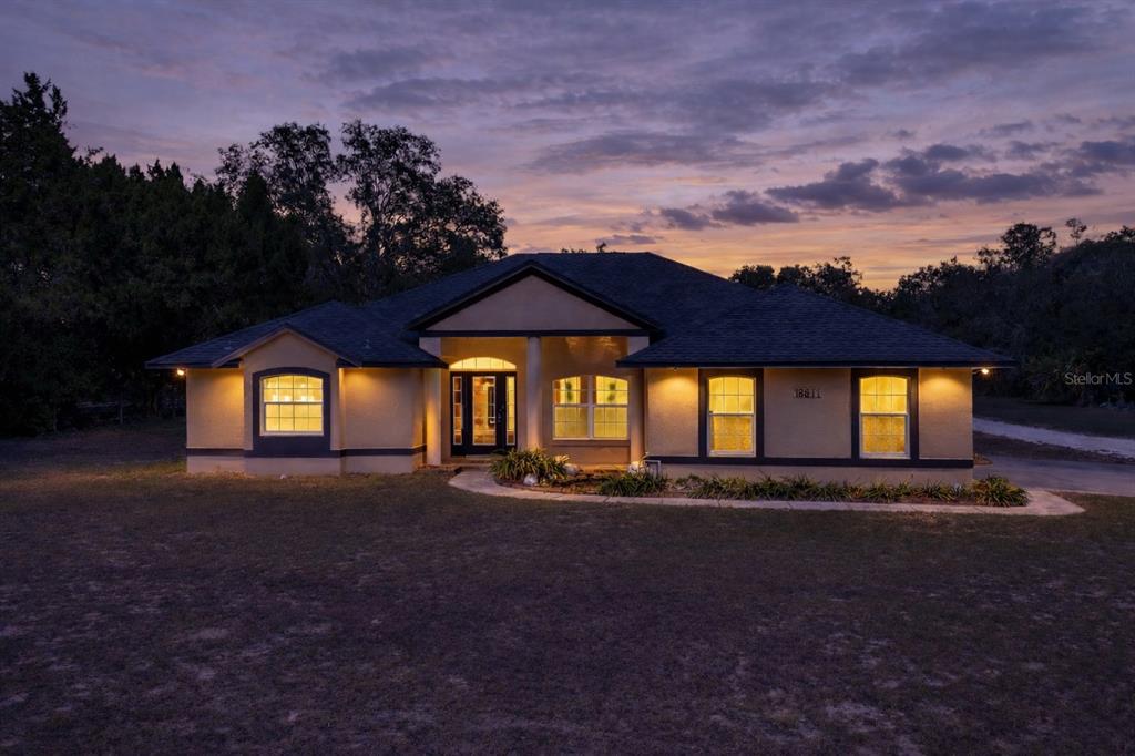 18611 Clark Road Altoona, FL 32702 - Photo 48 of 48 a front view of house with yard and green space
