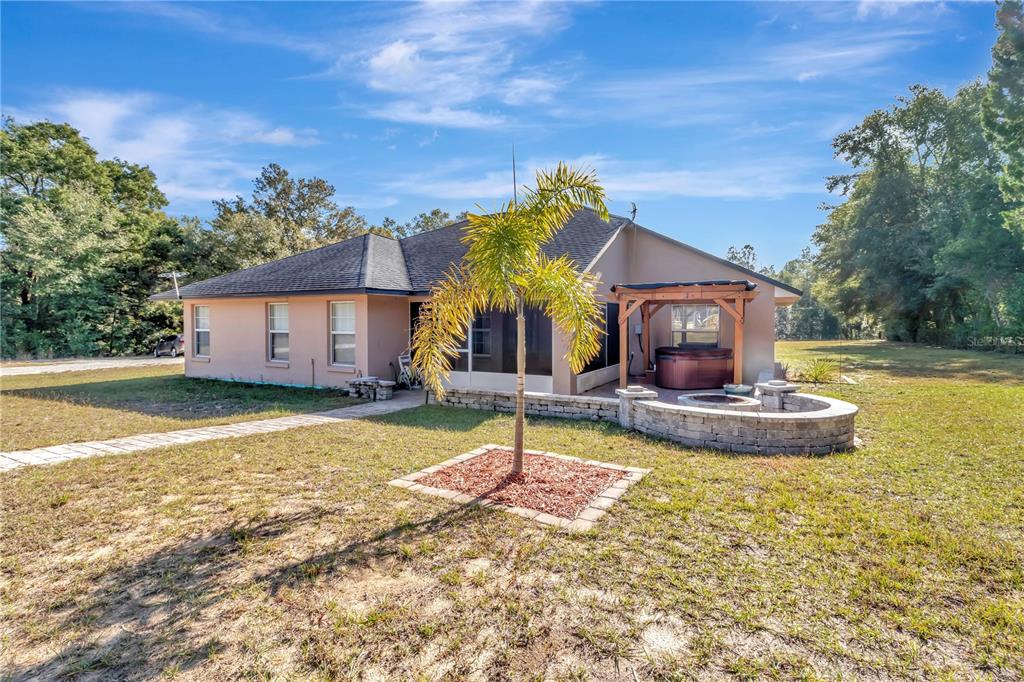 18611 Clark Road Altoona, FL 32702 - Photo 6 of 48 a view of a house with swimming pool and a yard