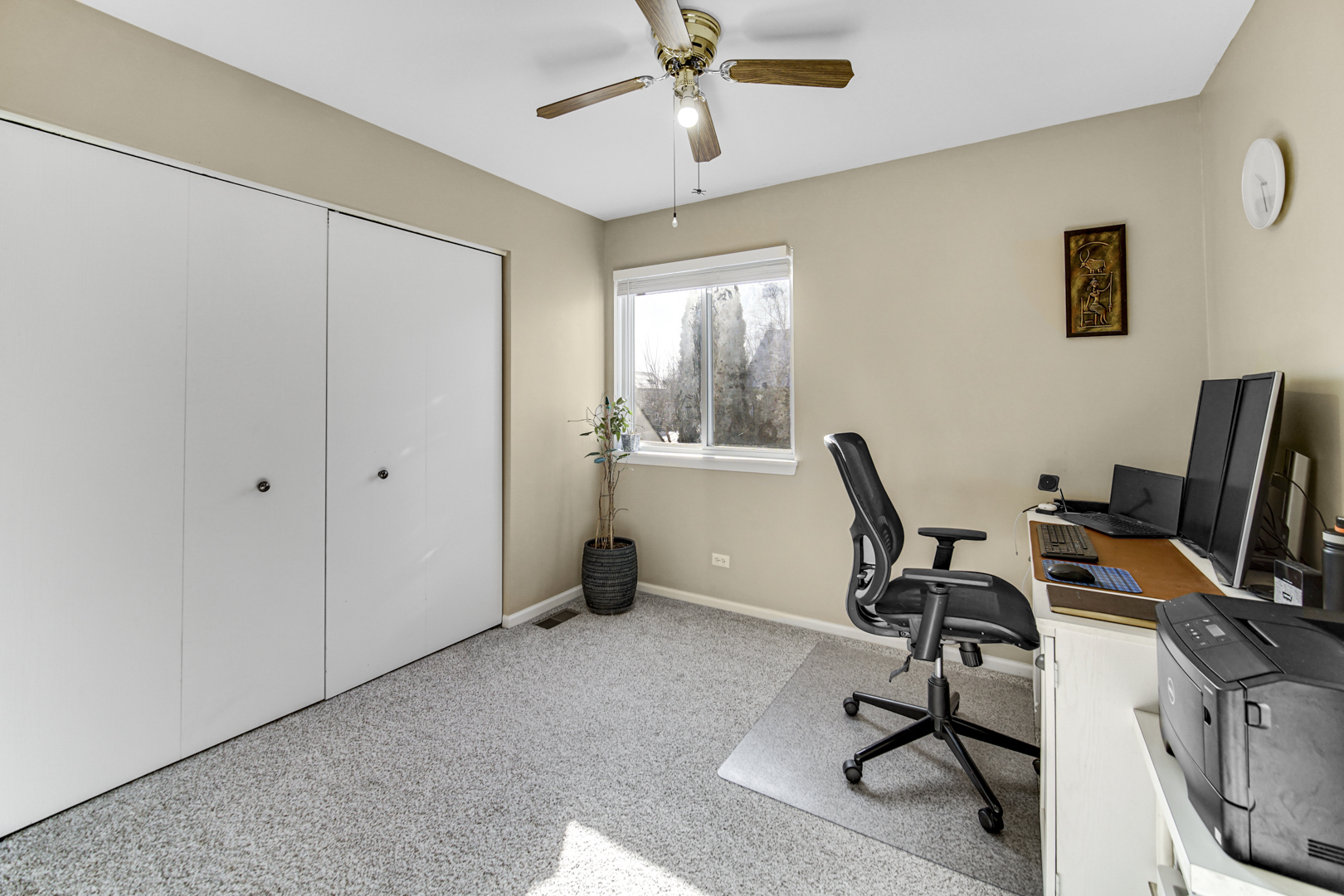 1384 Roxbury Drive Aurora, IL 60502 - Photo 16 of 24 a view of a workspace with furniture and a window
