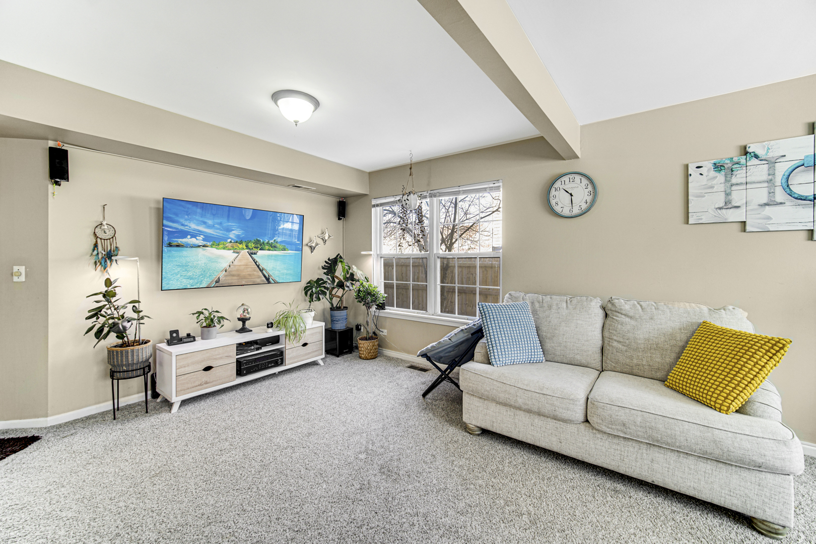 1384 Roxbury Drive Aurora, IL 60502 - Photo 19 of 24 a living room with furniture and a flat screen tv