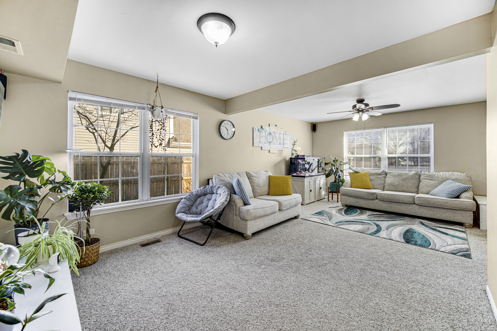 1384 Roxbury Drive Aurora, IL 60502 - Photo 21 of 24 a living room with furniture and a large window