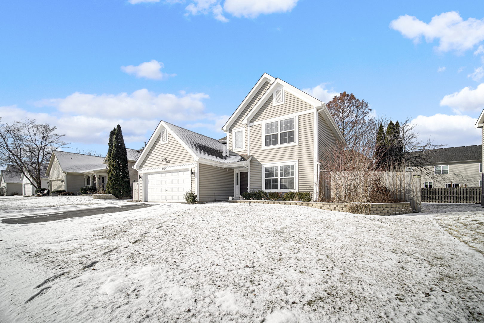 1384 Roxbury Drive Aurora, IL 60502 - Photo 3 of 24 a front view of a house with a yard