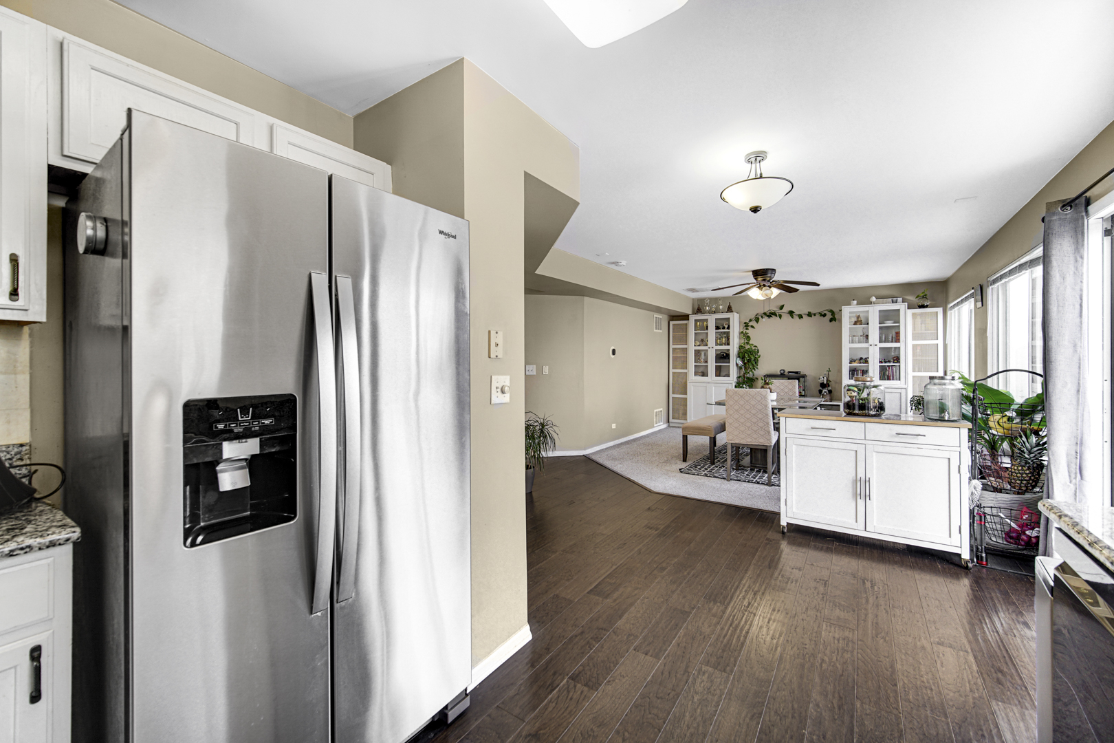 1384 Roxbury Drive Aurora, IL 60502 - Photo 6 of 24 a kitchen with a refrigerator and white cabinets